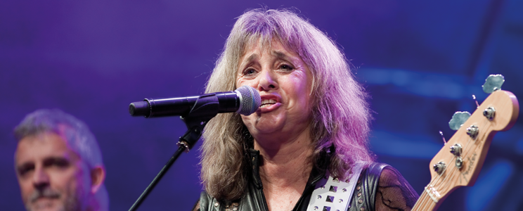 Suzi Quatro playing guitar