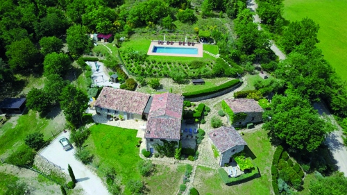 Aerial view of houses and outbuildings
