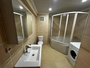 large-fully-tiled-bathroom