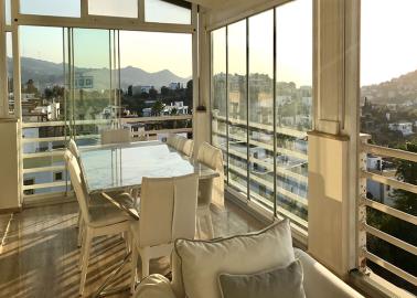 nice-extra-living-space-on-glassed-in-balcony