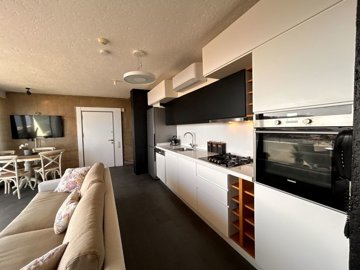 Magnificent Sea View Apartment For Sale In Bodrum - Kitchen through to main entrance door