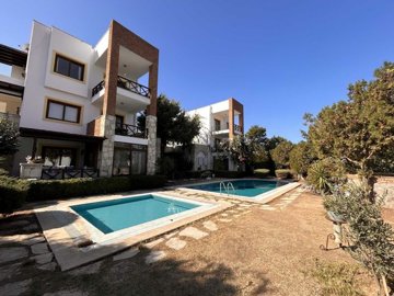 A Beautiful Furnished Apartment In Bodrum For Sale - Communal pool and gardens