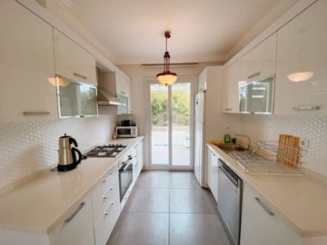 Exquisite Fethiye Property For Sale - A gorgeous, fresh and modern kitchen, with built-in appliances