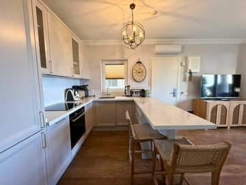 Seafront Property For Sale In Kadikalesi, Bodrum - Fully fitted and equipped kitchen with breakfast bar