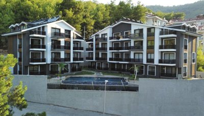 Nature View Fethiye Property For Sale - A modern hillside complex of apartments