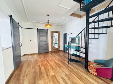 An Exceptional Didim Beachfront Villa For Sale – Open-plan living area and spiral staircase