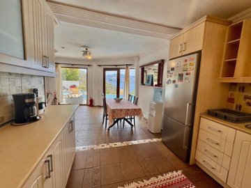 An Idyllic Detached Kalkan Villa For Sale - From the kitchen to the dining area