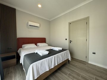 Stylish Investment Property For Sale In Fethiye - Bedroom with laminate flooring