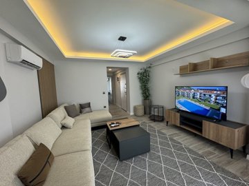 Stylish Investment Property For Sale In Fethiye - Large lounge with ambient lighting