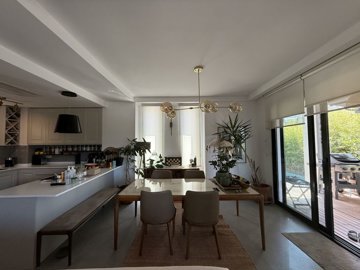 A Tranquil Duplex Yalikavak Property For Sale - Dining area with terrace and pool access