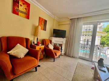 Ready-To-Move Semi-Detached Villa For Sale In Fethiye - Lounge with feature fireplace