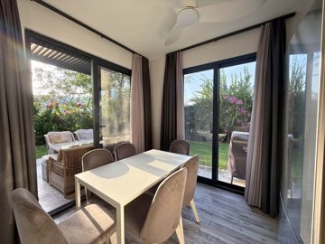 Alluring Garden Apartment In Bodrum For Sale - Dining area with garden views