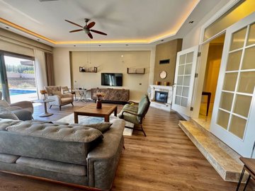 Striking Fethiye Villa & Guest House For Sale - Stunning lounge with fireplace