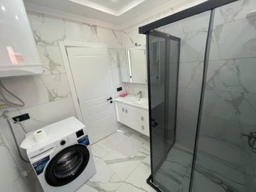 Attractive Detached Duplex Villa For Sale In Akbuk – Family bathroom with washing machine