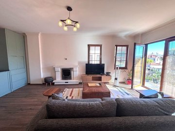 Renovated Apartment For Sale In Dalyan - Lounge with electric fireplace