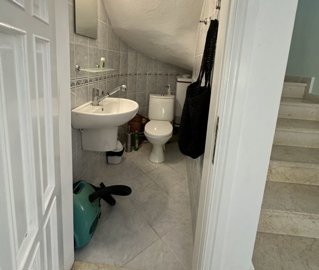 Ready-To-Move Dalyan Villa For Sale With Communal Gardens & Pool - Convenient WC under the stairs