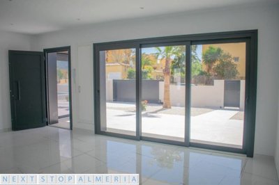 Open plan living space with patio doors closed