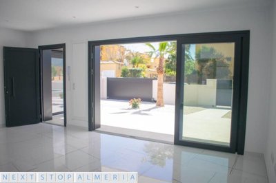 Open plan living space with patio doors open