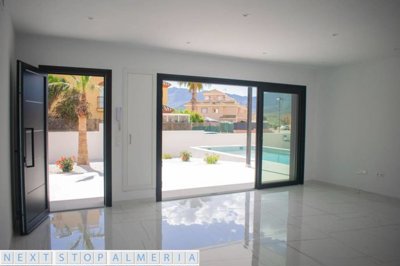 Open plan living space with patio doors open